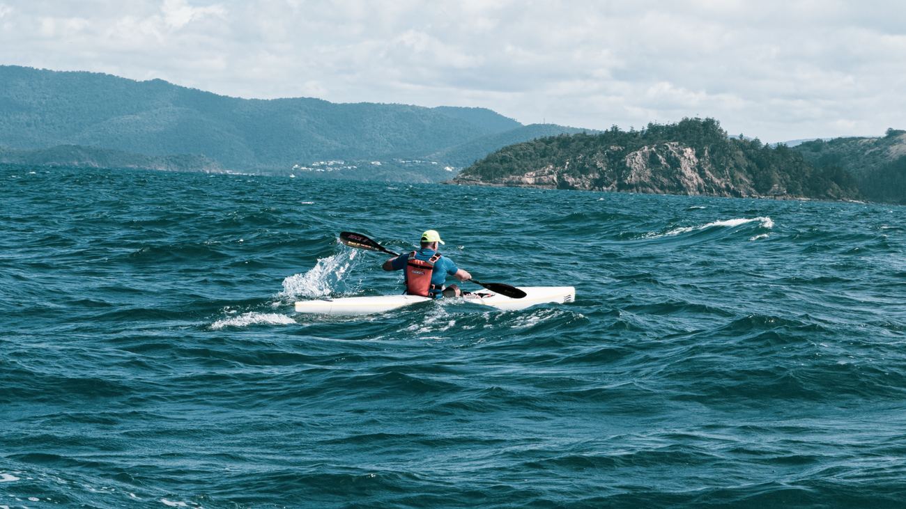 Solo paddler into the chop