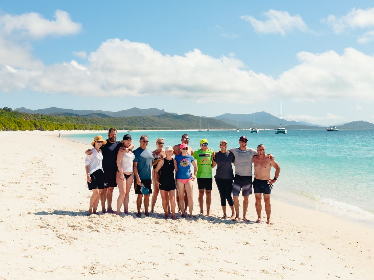 The full company on Whitehaven Beach, second frame