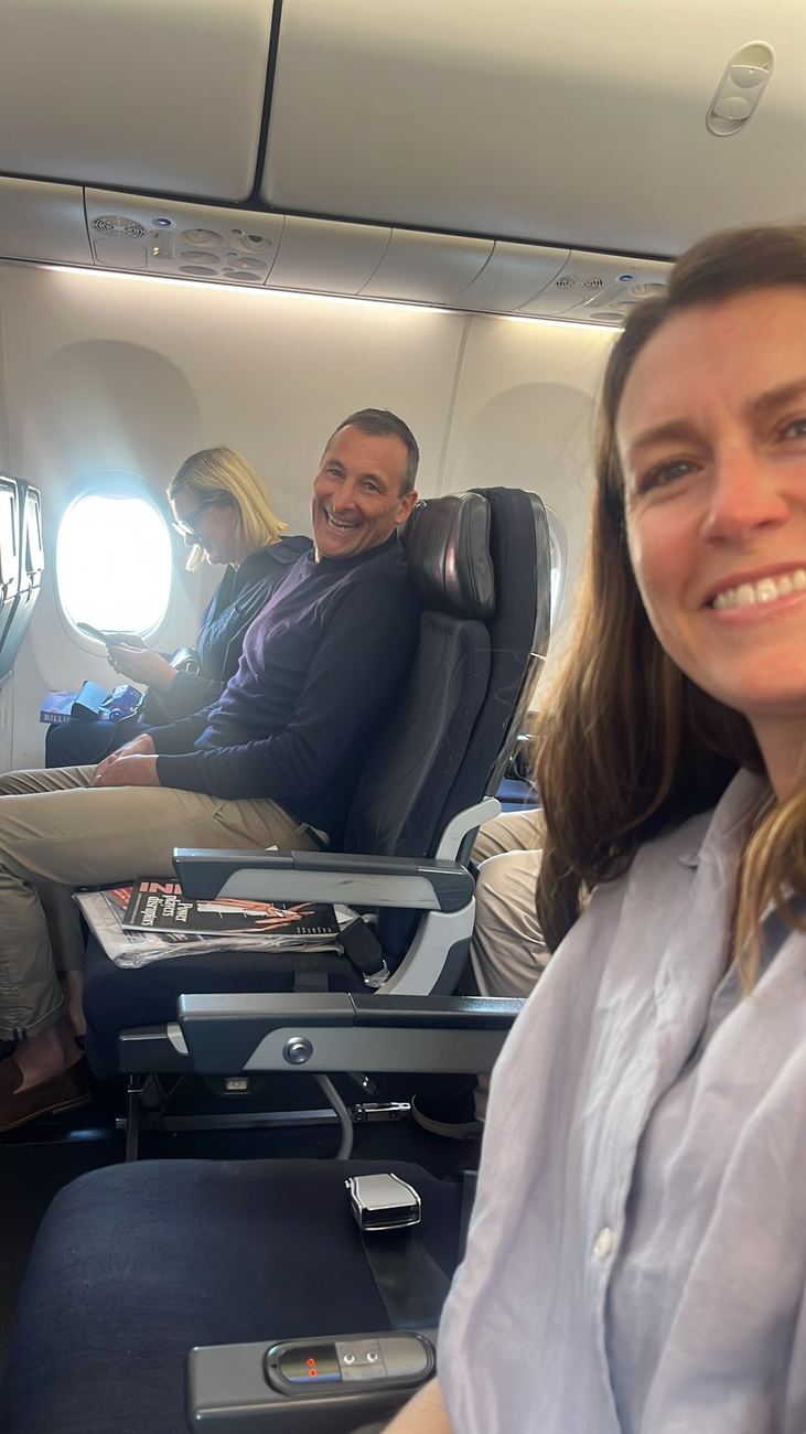 Selfie across the aisle in the cabin, all smiles