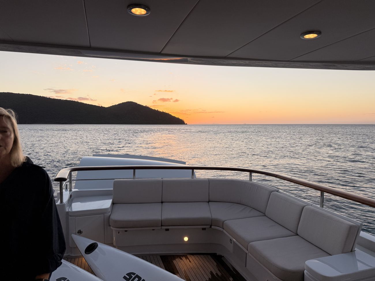 Sunset over the water from the aft deck rail at Cid Harbour