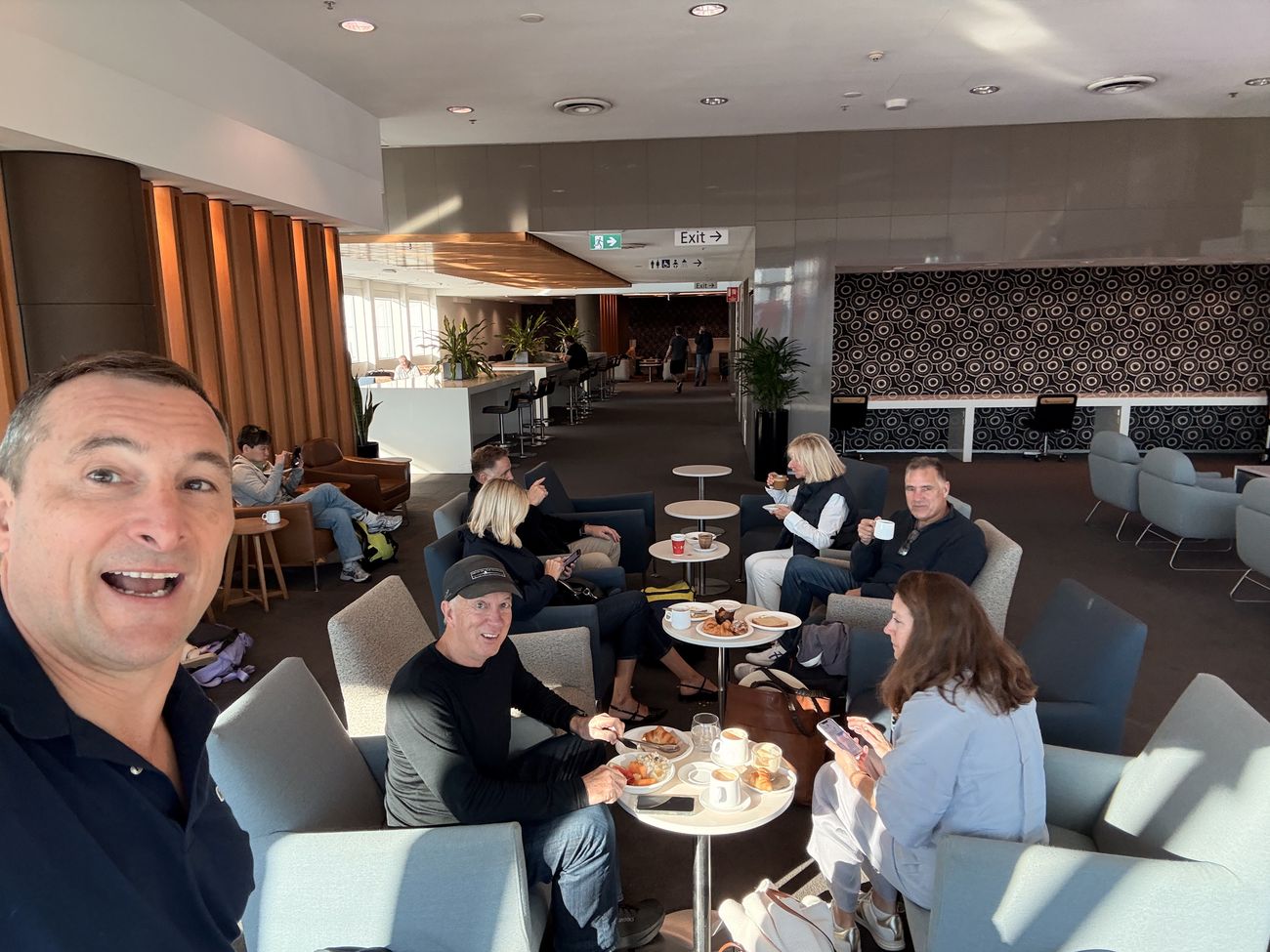 The group gathering in the airport lounge before the flight north