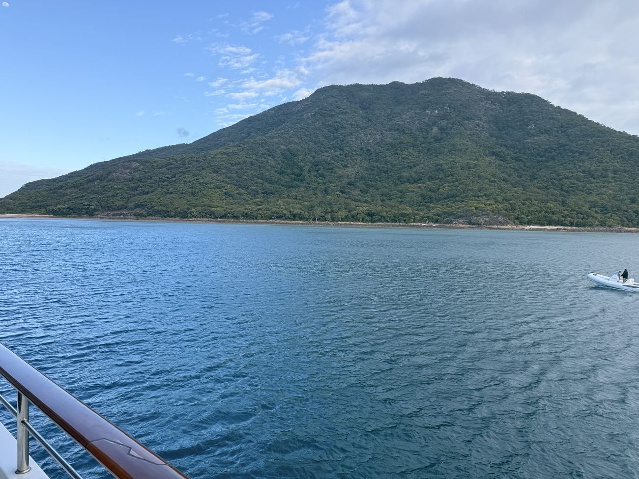 Shaw Island's green hills ahead from the rail