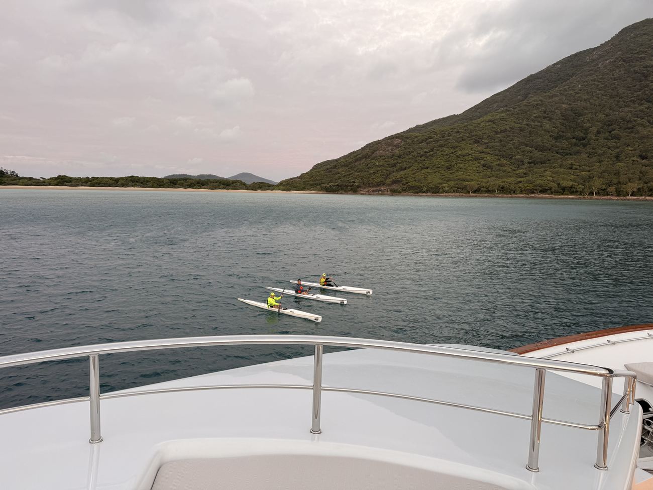 A lone paddler in the last light off the bow