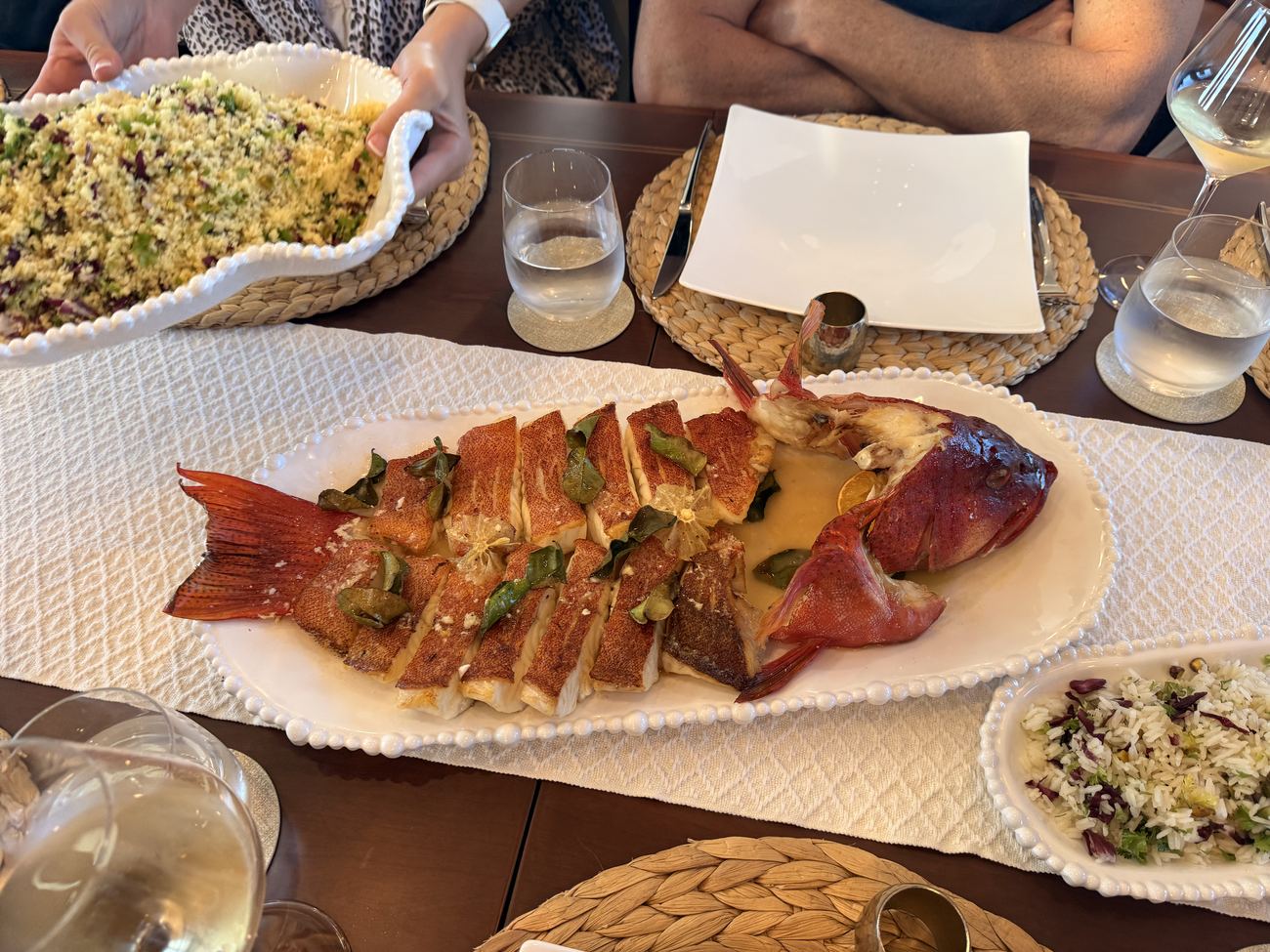 The whole roasted coral trout on a platter