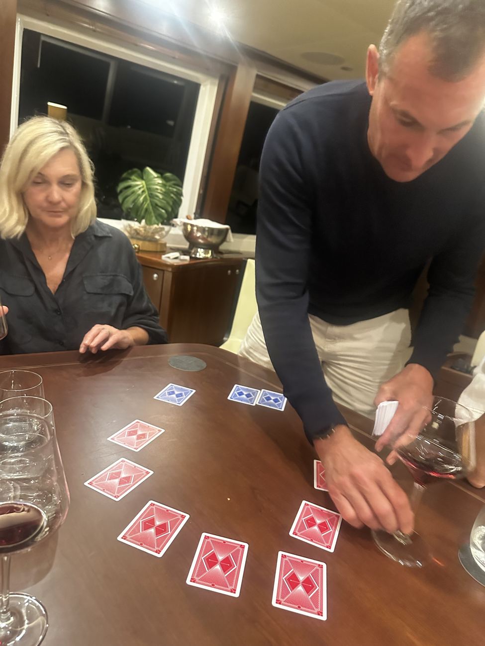Cards spread across the saloon table mid-game