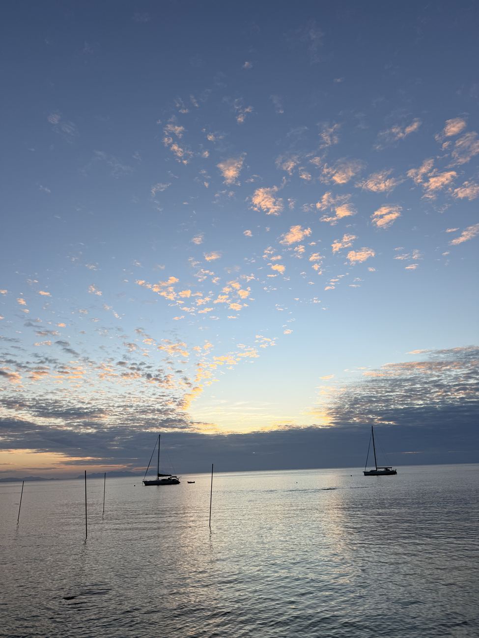 Pastel sky over the still anchorage