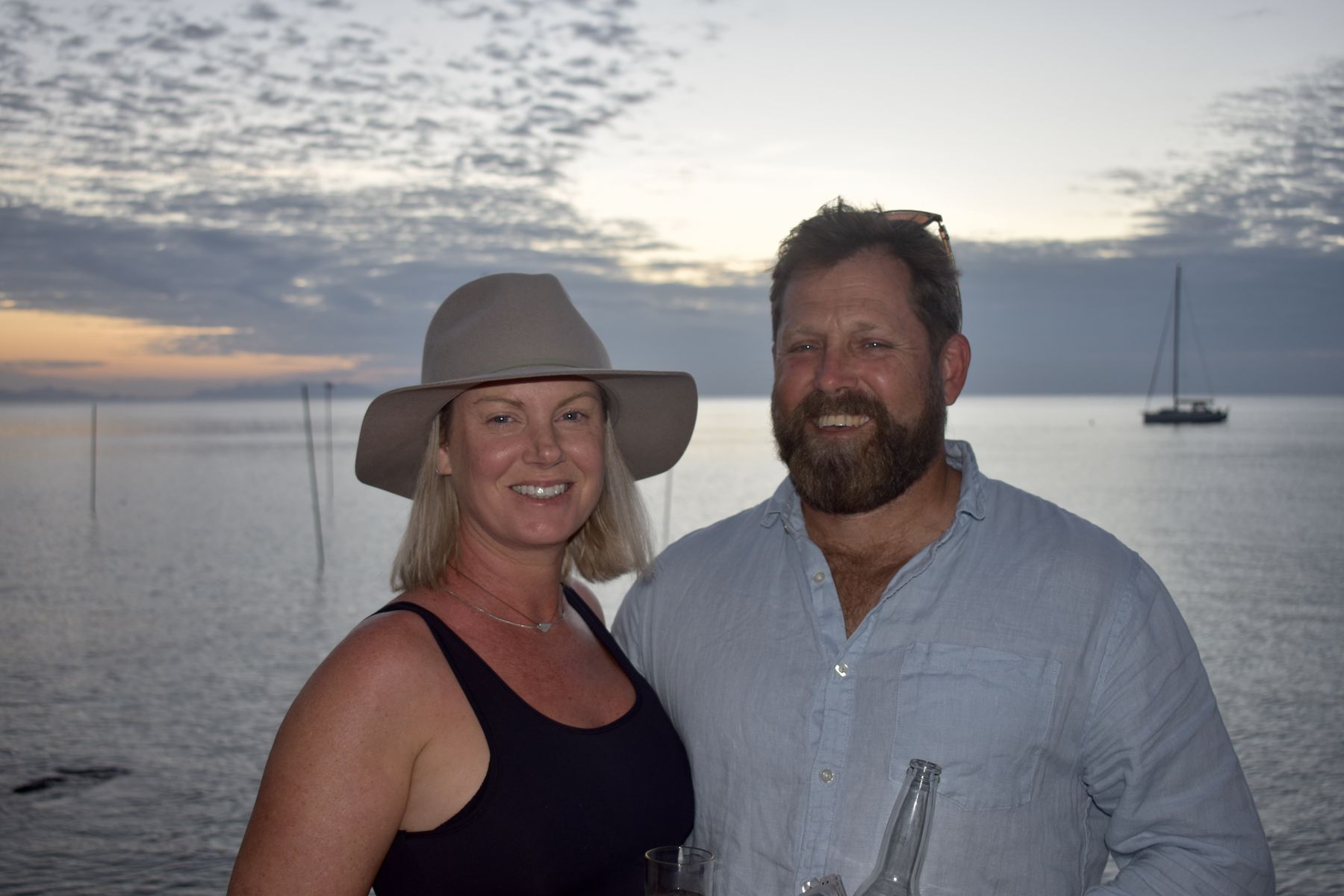 Couple portrait on the coral beach at golden hour