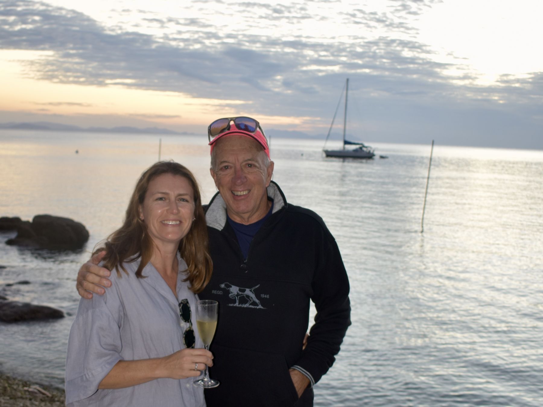 Couple portrait on the coral beach at golden hour