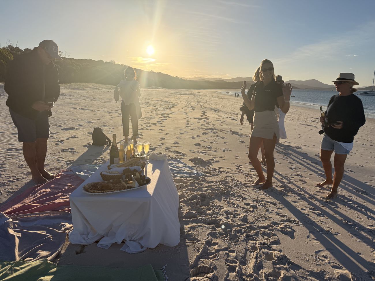 The picnic setup on Whitehaven Beach at golden hour
