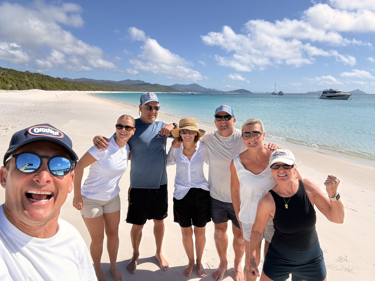 Team one, arm in arm on the sand