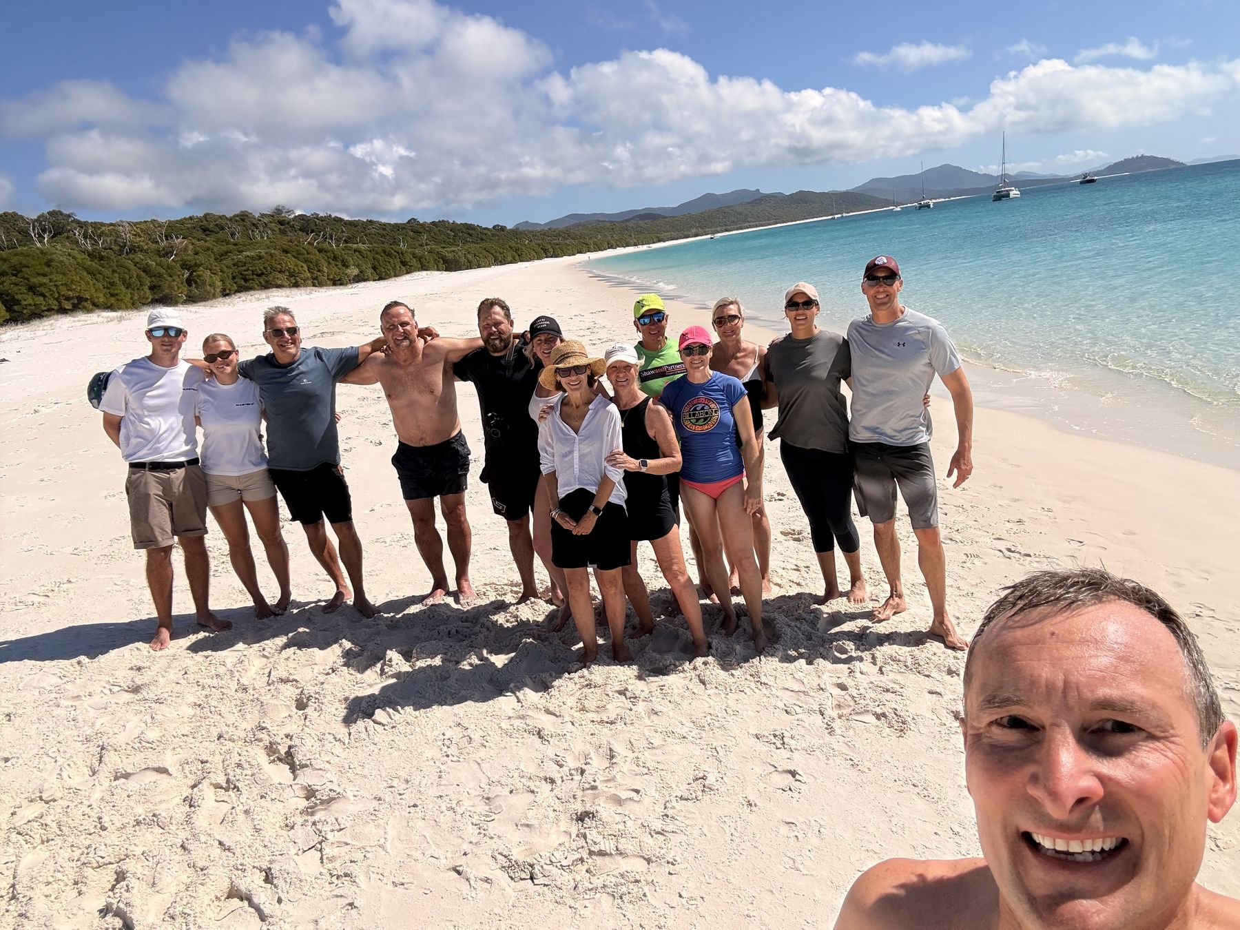 The full team selfie on the white sand at Whitehaven