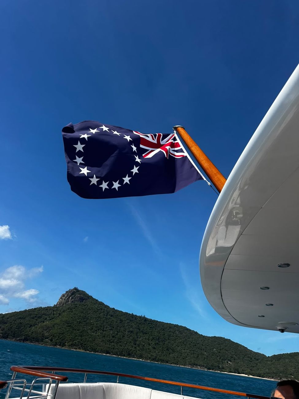 The Cook Islands ensign flying off the stern