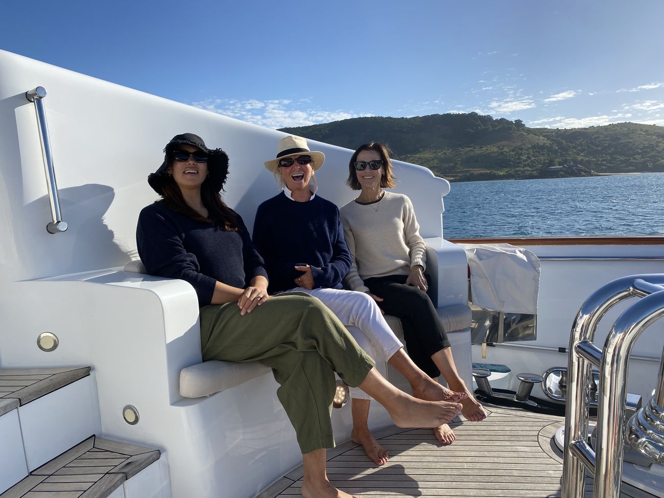 Three guests relaxing on the aft deck